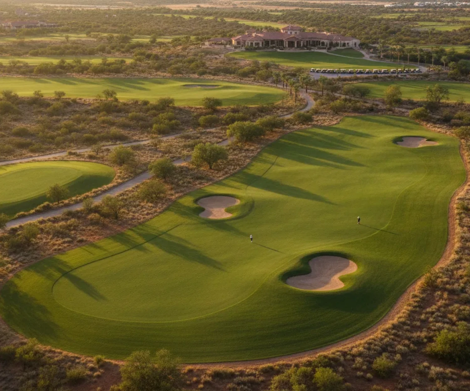 Aerial view of a well-kept Texas golf course at golden hour