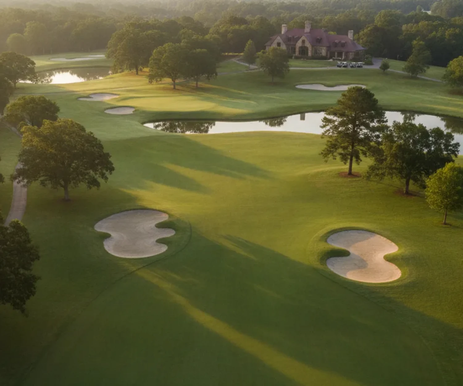 Aerial view of a Georgia golf course with tree-lined fairways and a clubhouse
